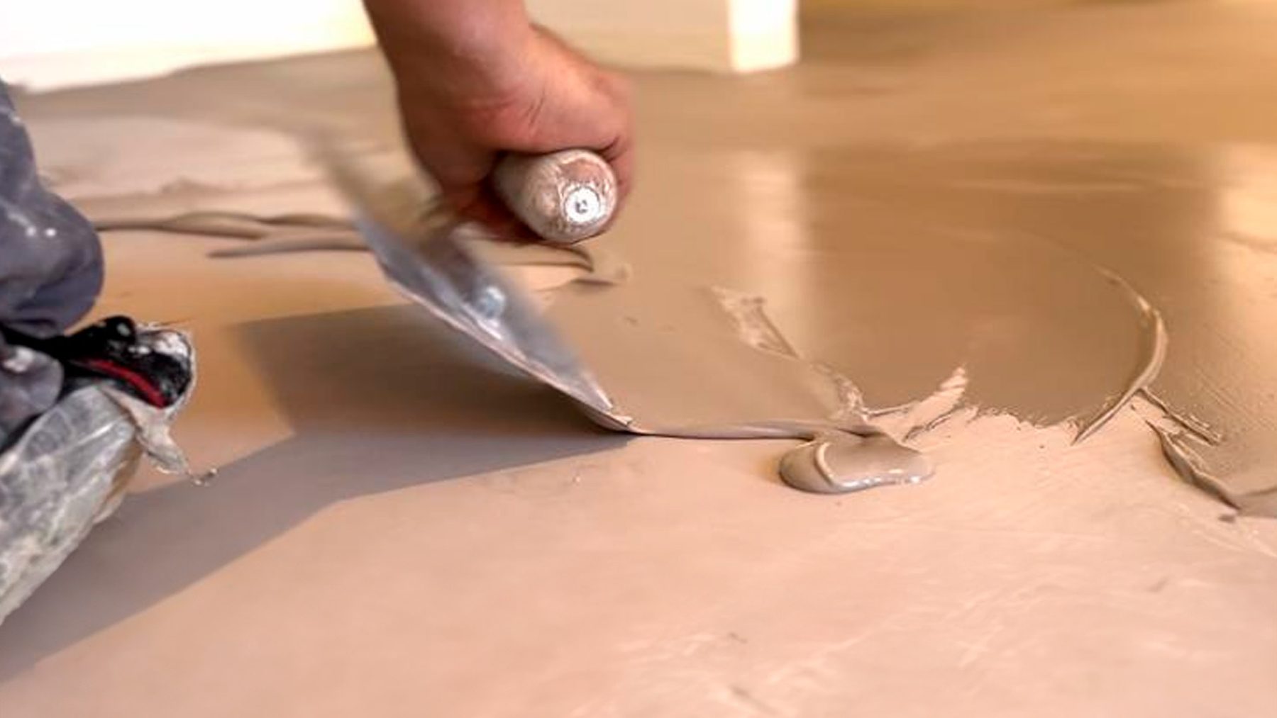 Microcement being applied with a trowel