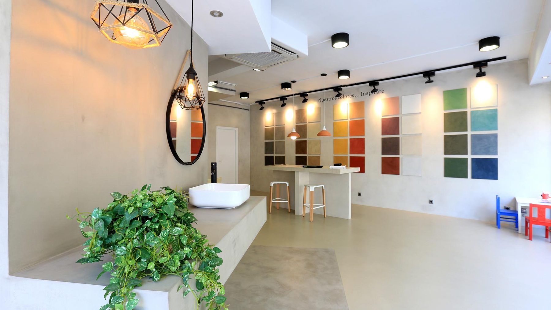 Showroom with microcement colour samples on the wall