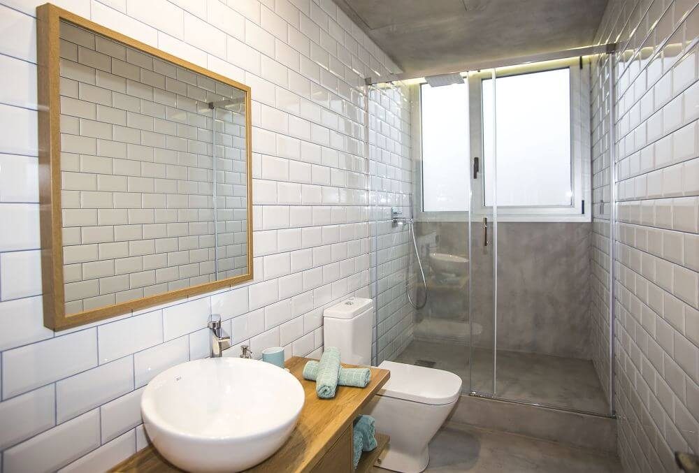 Microcement bathroom applied over existing tiles
